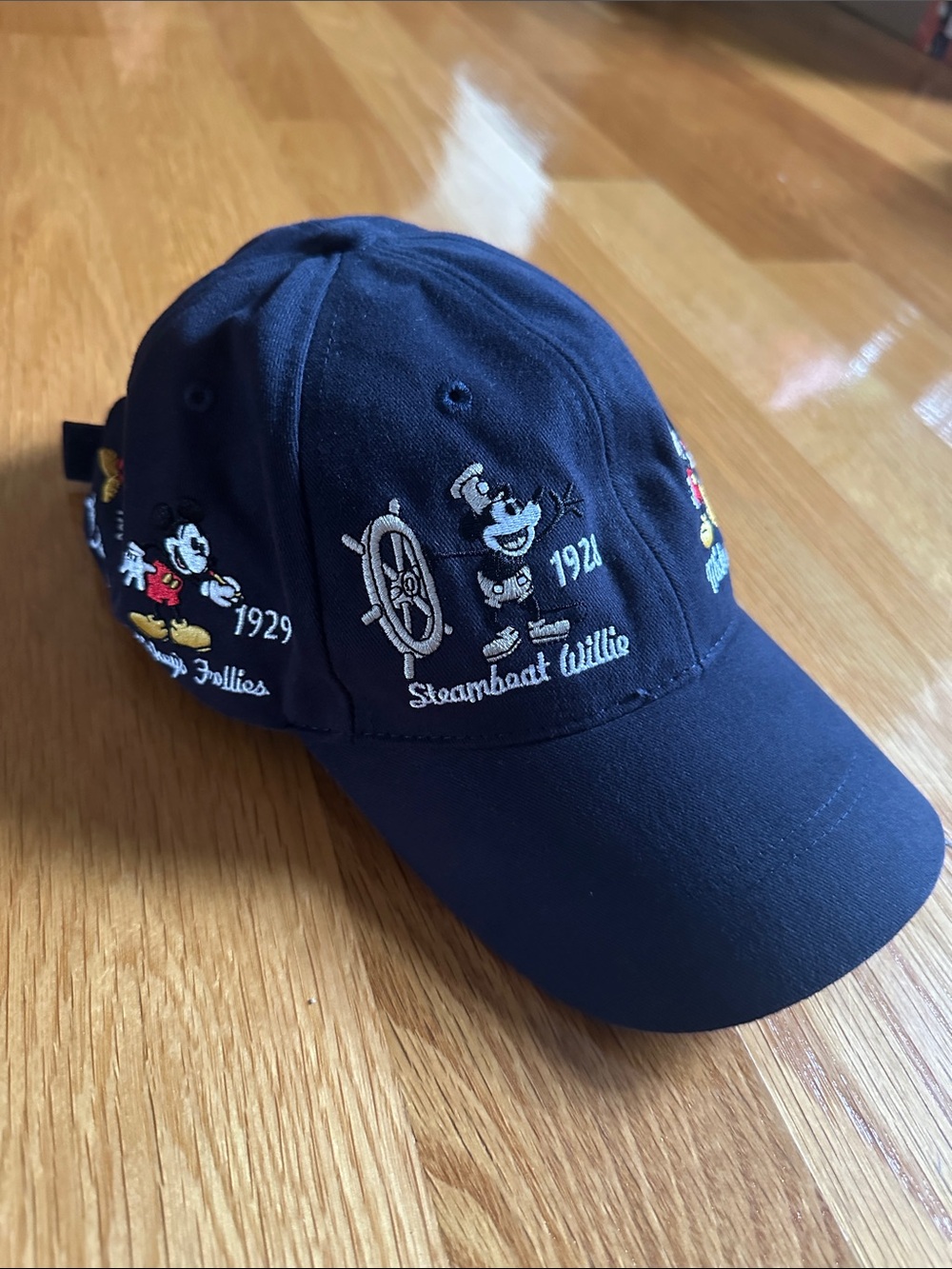 Disney baseball hat of Mickey thru the years